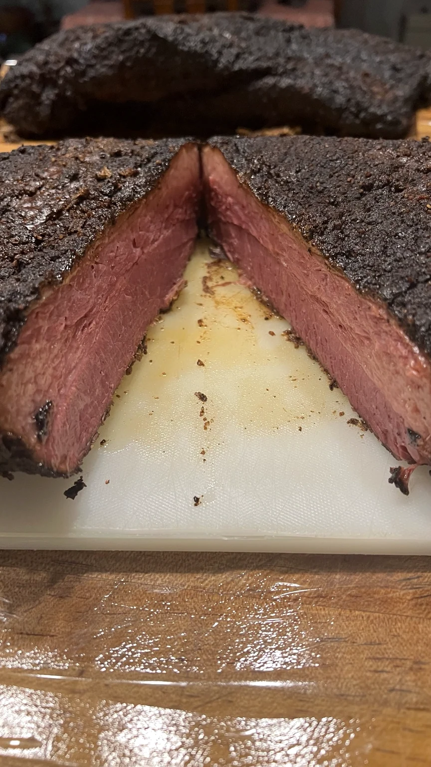Sliced beef Benstrami showing its rosy center and dark spice crust
