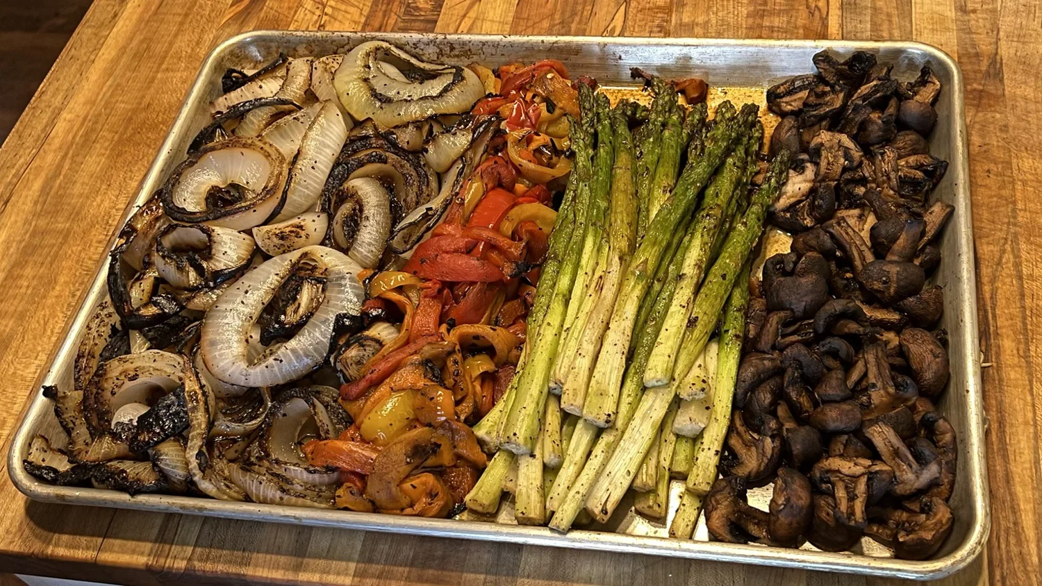 Roasted vegetables including asparagus, peppers and mushrooms